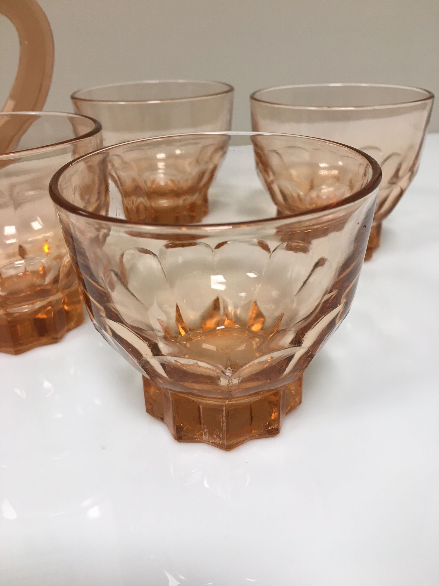 Orange pitcher and 4 rosaline glasses