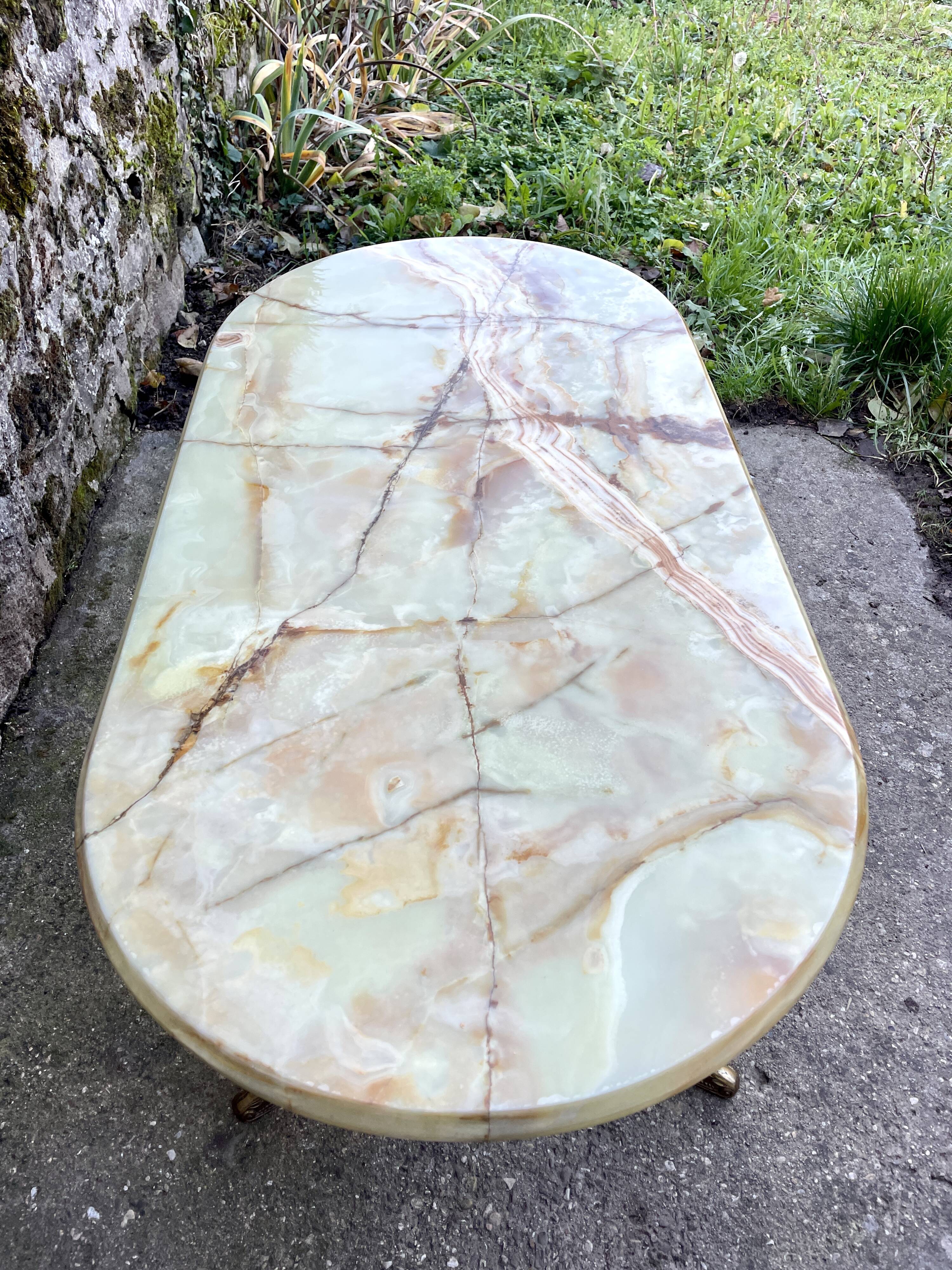 Louis XVI style oval coffee table in onyx and gilt brass
