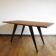 Teak and steel table design