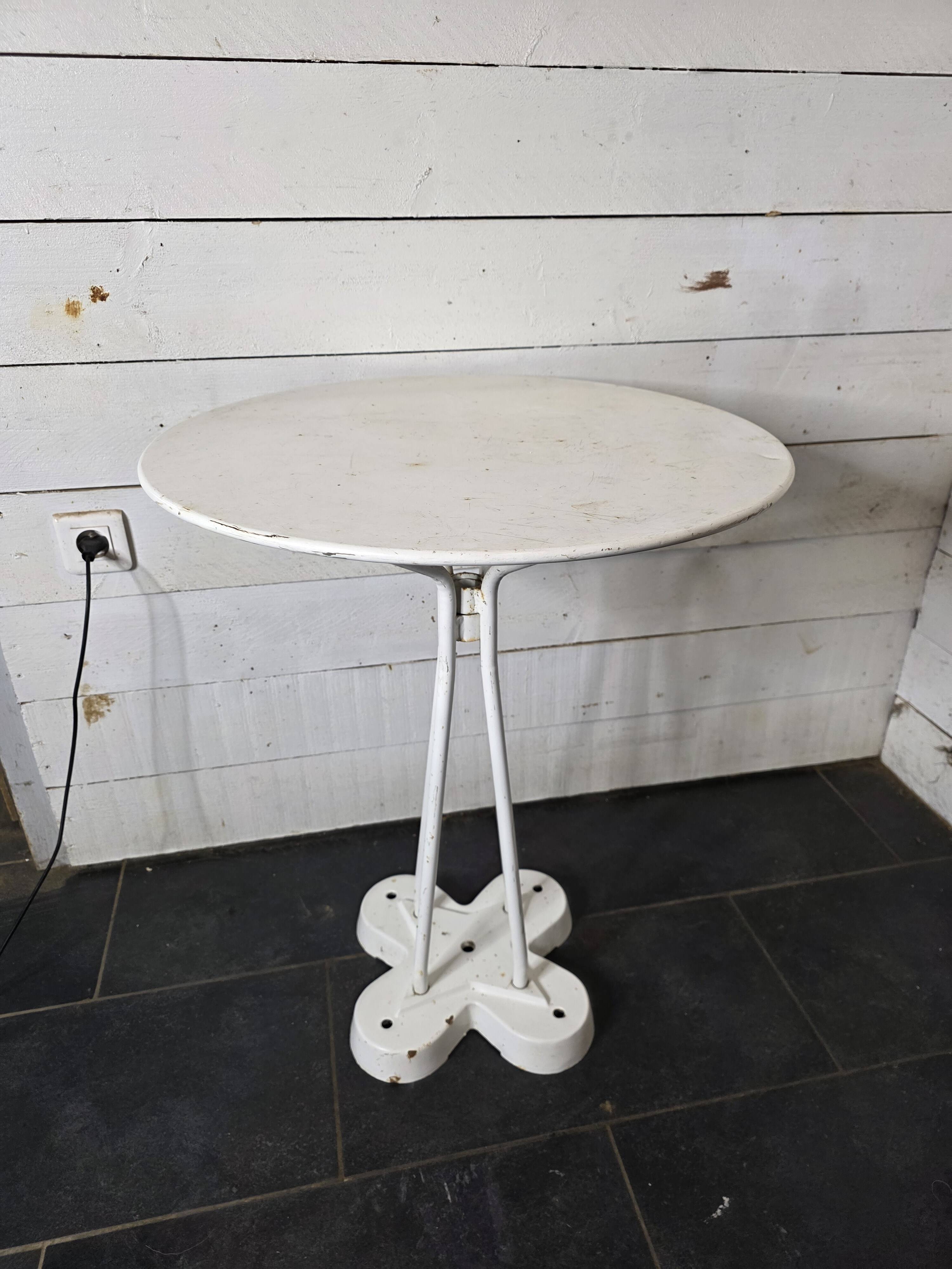 Iron garden table with cast iron legs