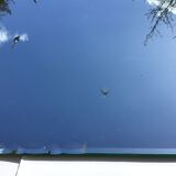 Bevelled mirror trapeze two waves at the top