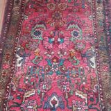 Vintage oriental rug from the 1930s. Handcrafted, handmade. Worn.