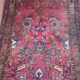 Vintage oriental rug from the 1930s. Handcrafted, handmade. Worn.