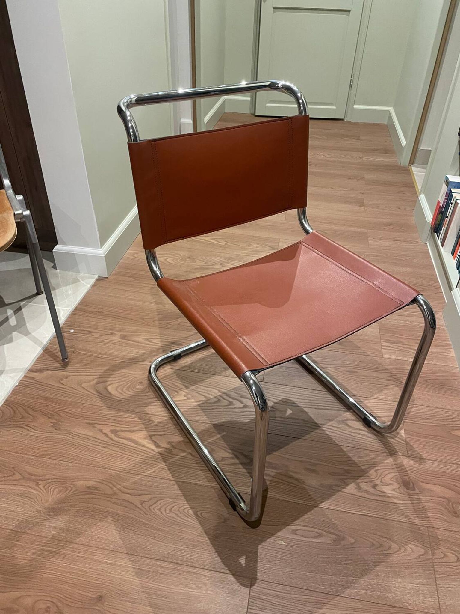 Hanging chair in Mart Stam S33 style in chrome metal and cognac imitation leather