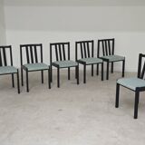 Set of 6 modernist black chairs with light blue-green ribbed fabric.