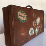Suitcase of leather with labels of palaces
