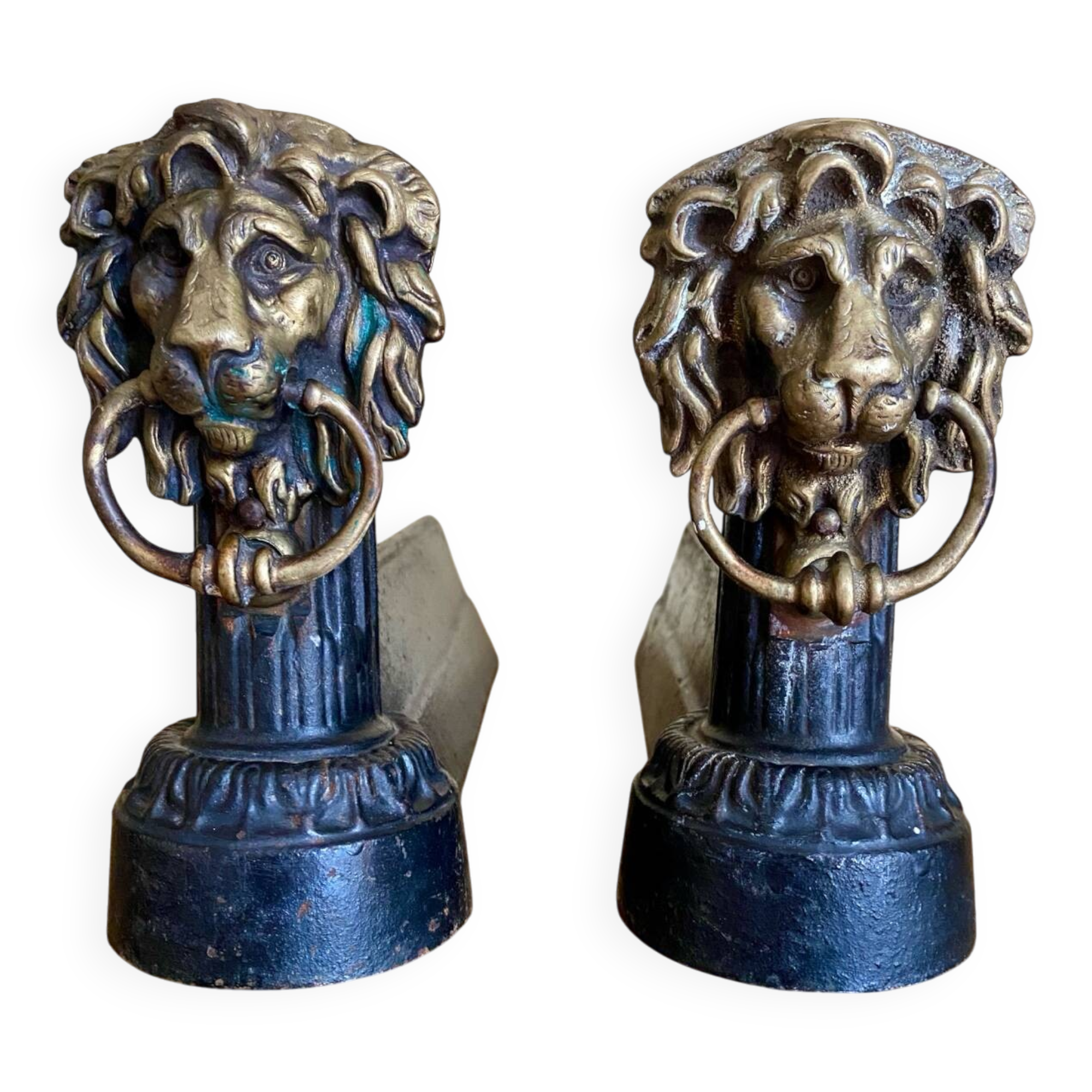 Pair of antique fire dogs with lion heads - patinated cast iron