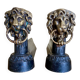 Pair of antique fire dogs with lion heads - patinated cast iron