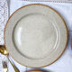 Round dish in tulowice speckled sandstone