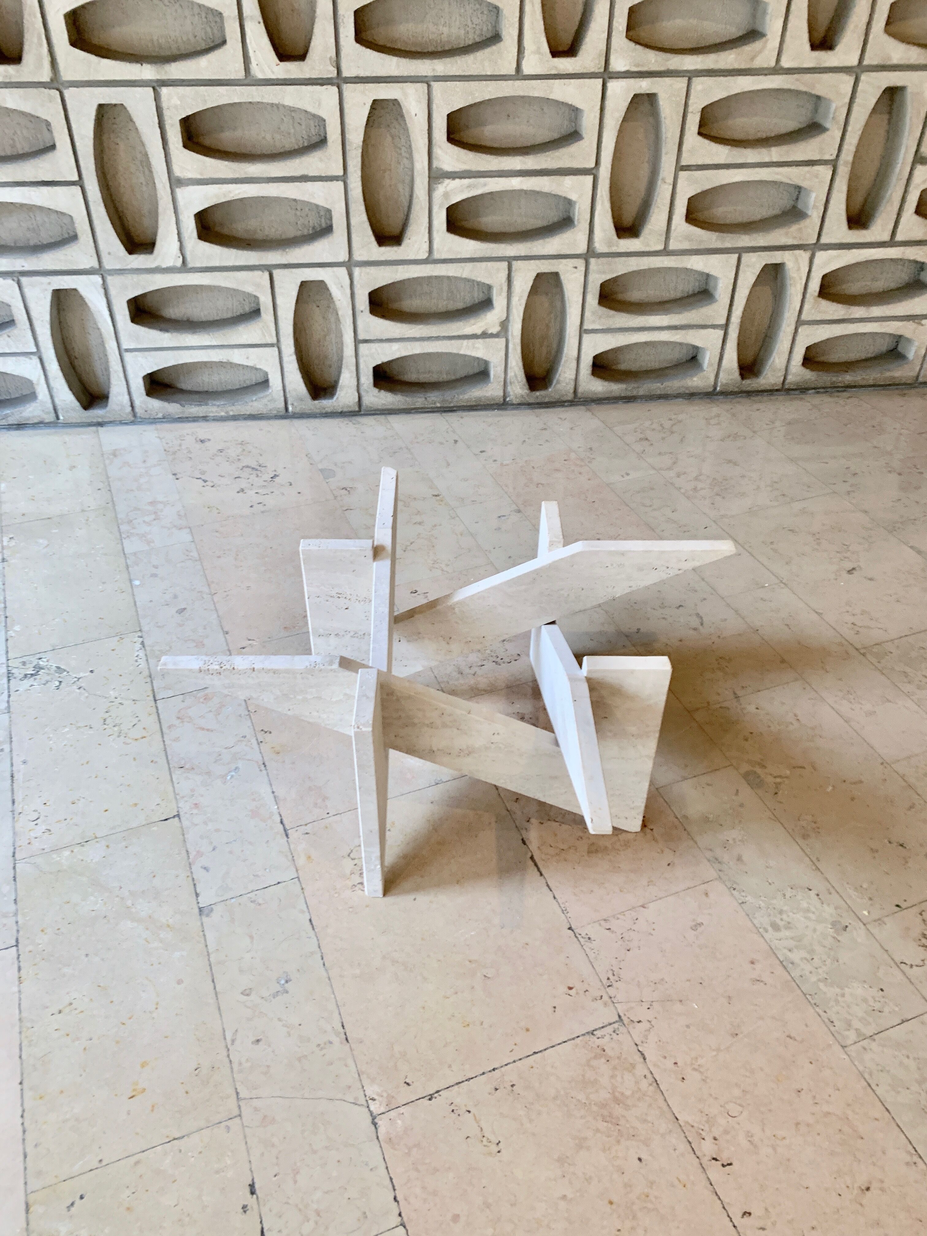 Travertine sculptural coffee table with square top