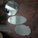 Three beveled mirrors