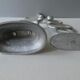Pair of cast aluminum candle holders, design