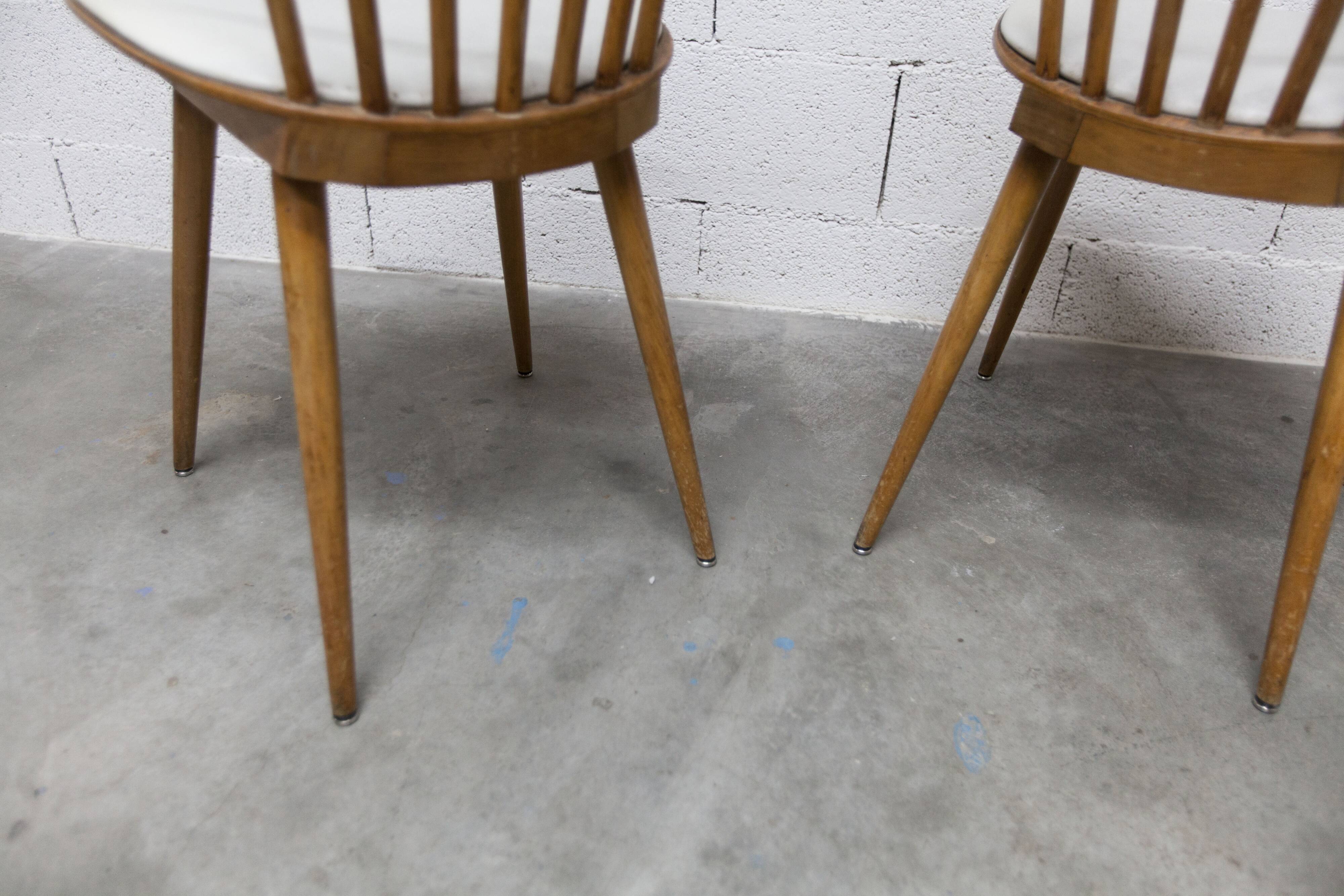 Pair of Baumann Menuet chairs, Honey patina, White vinyl seats