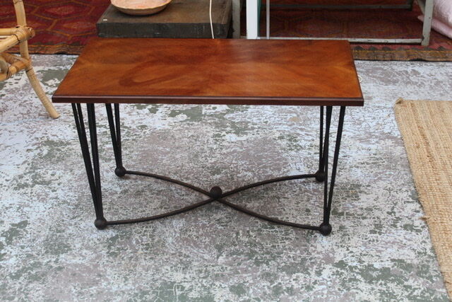 Black metal footing wooden coffee table