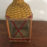 Bottle sheathed on the top and the low d wicker woven