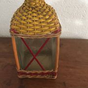 Bottle sheathed on the top and the low d wicker woven