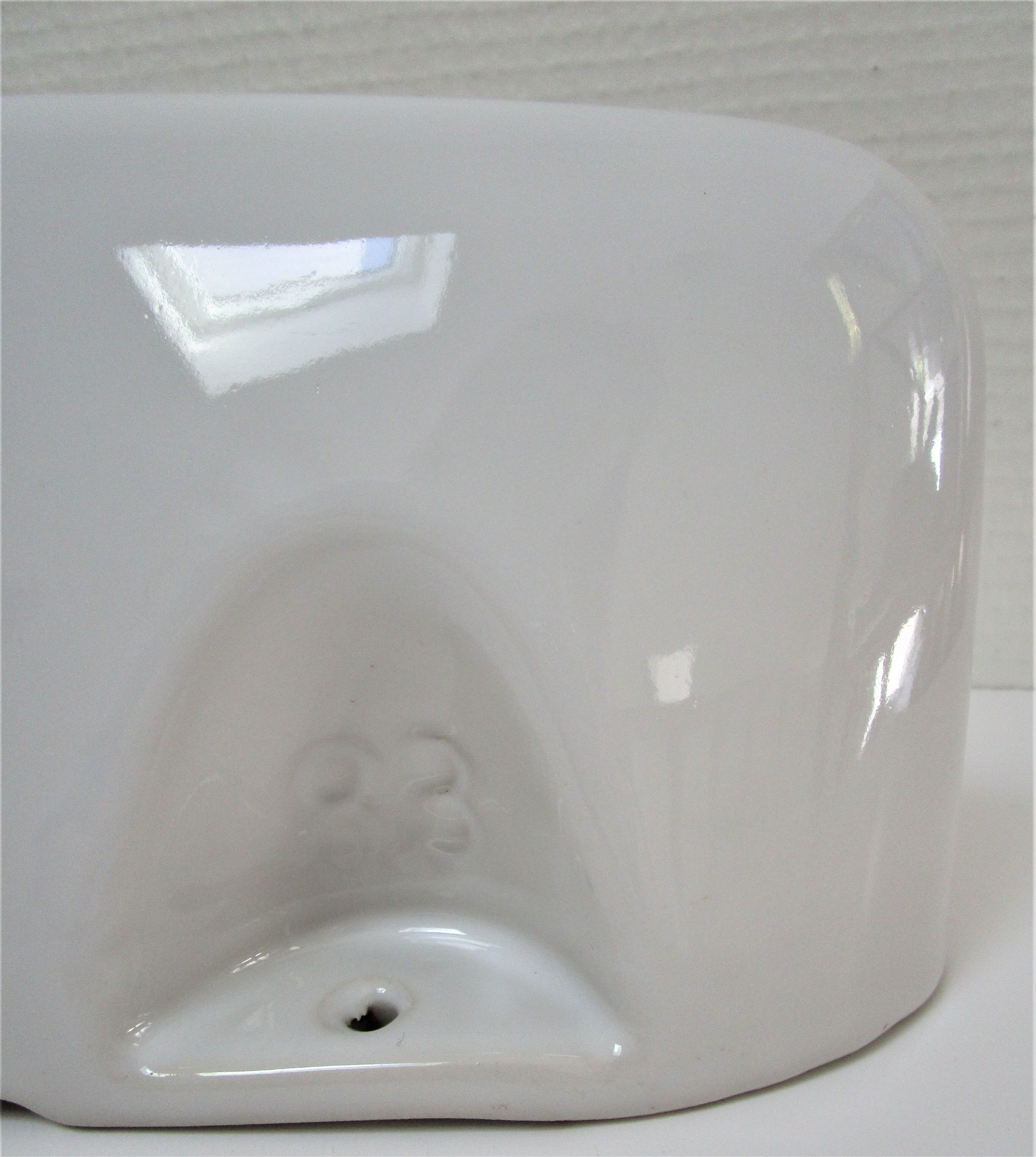 Vintage white enamelled ceramic wall shelf