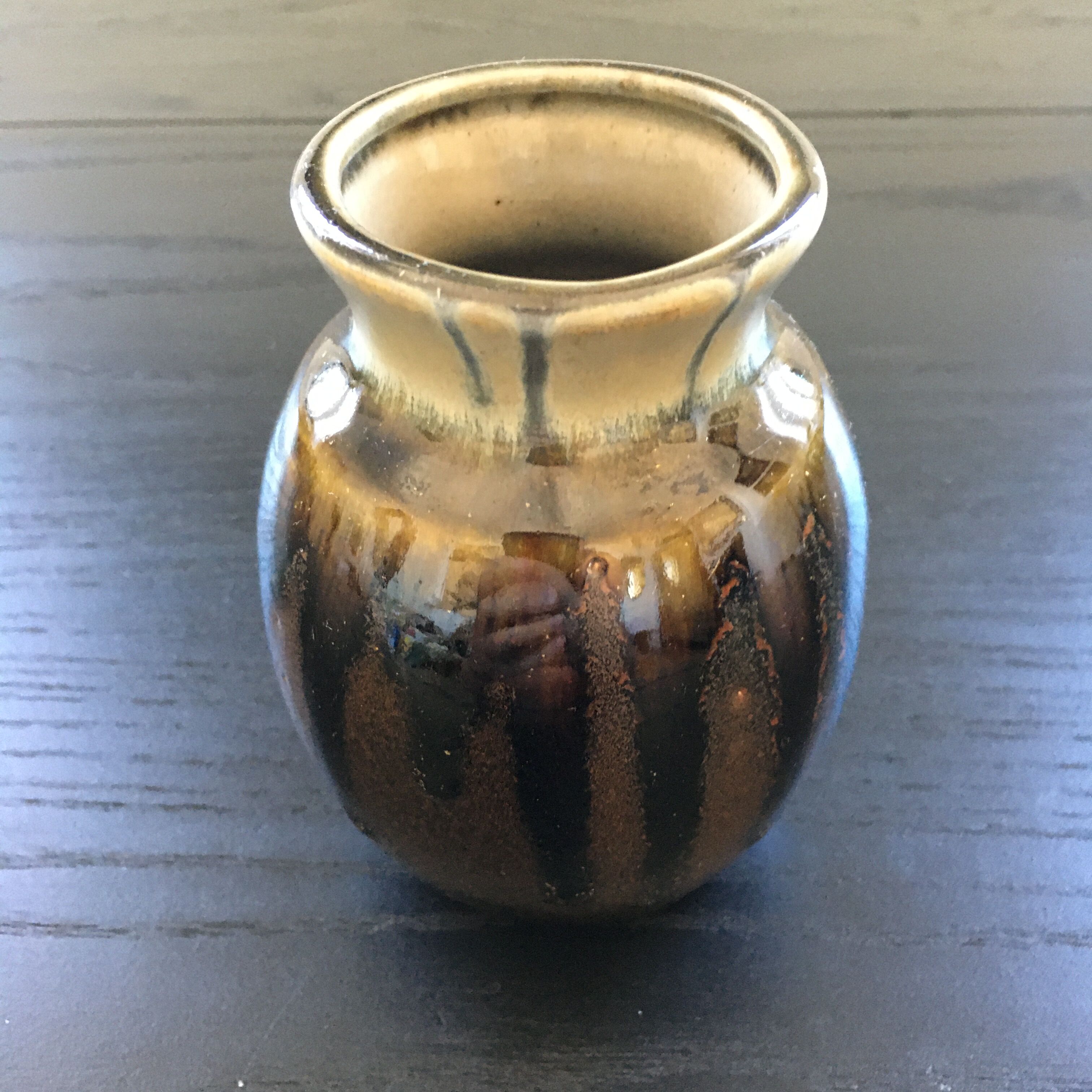 Brown and black flame-colored vase