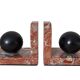 Pair of red marble bookends with black stone spheres – Art Style