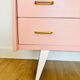 1950s pink and gold chest of drawers