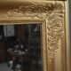 Important miroir en bois doré, style Restauration – Milieu XIXe