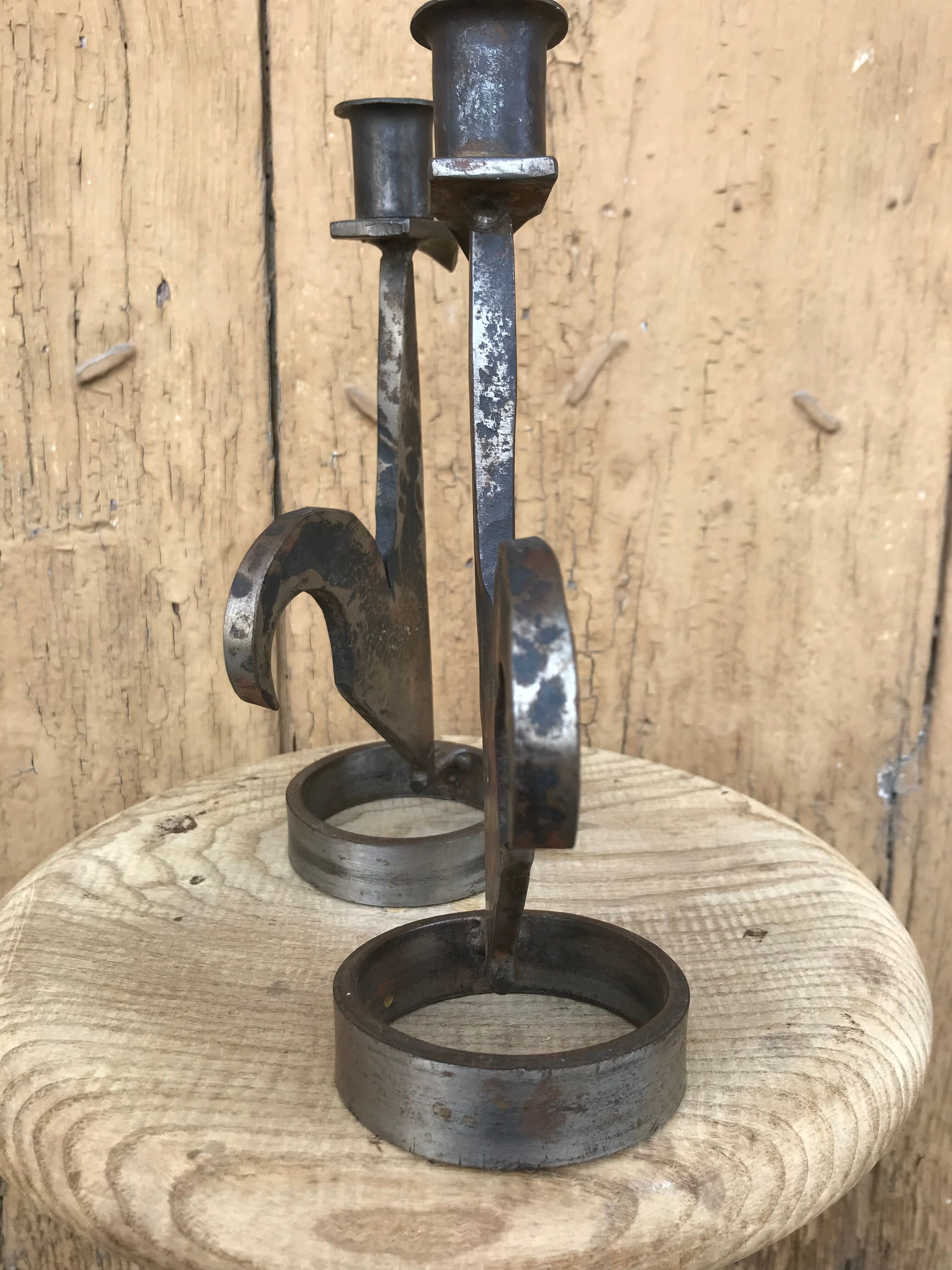 Signed zoomorphic iron candle holders