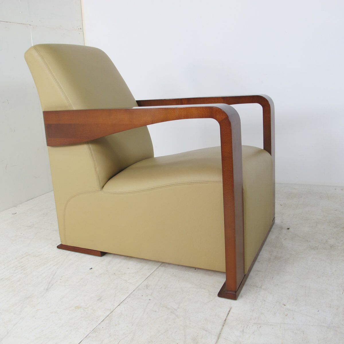 Leather armchair and art deco wood with Oottoman by Hugues Chevalier 2000s
