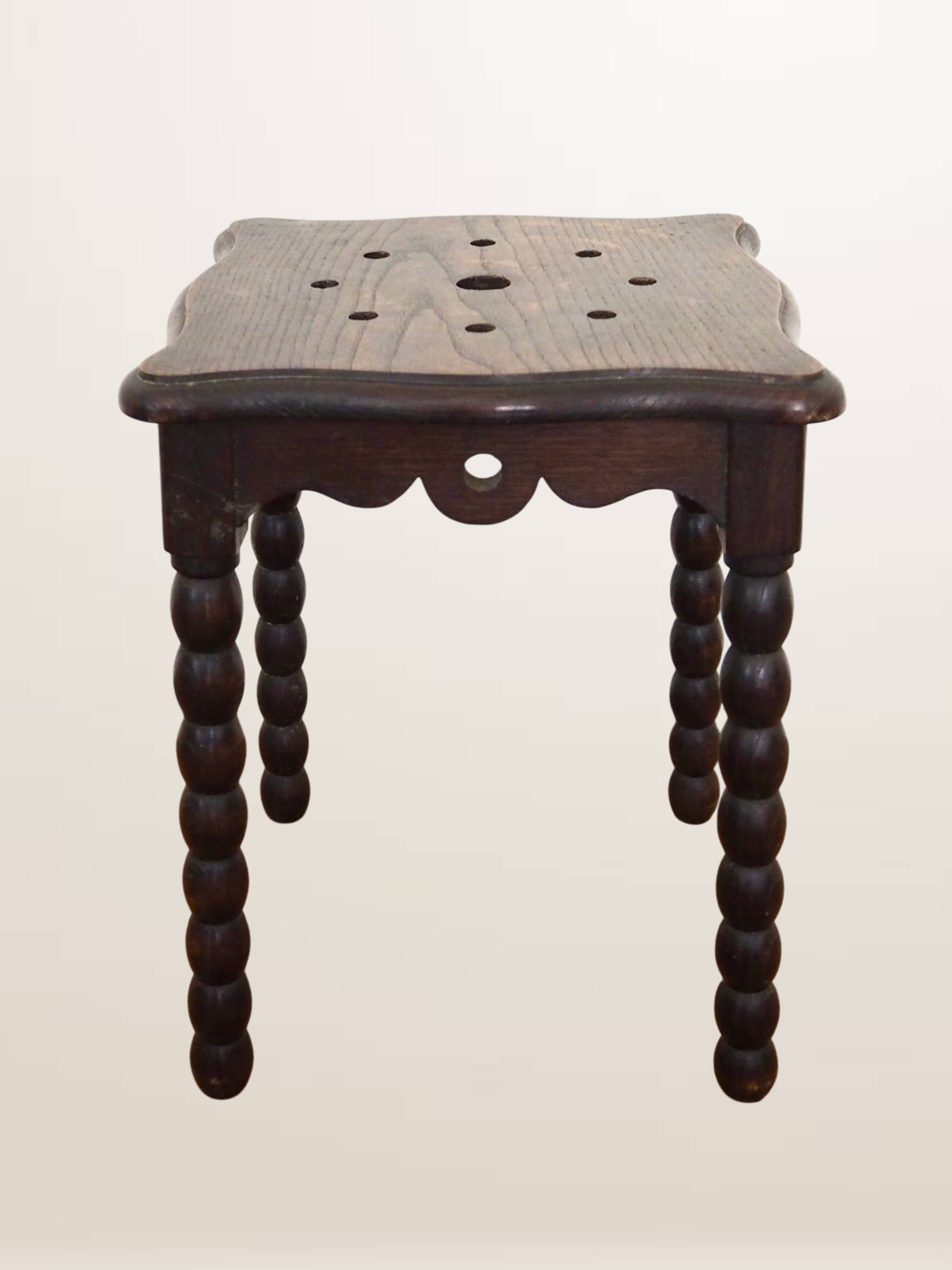 Oak stool with beaded spool legs