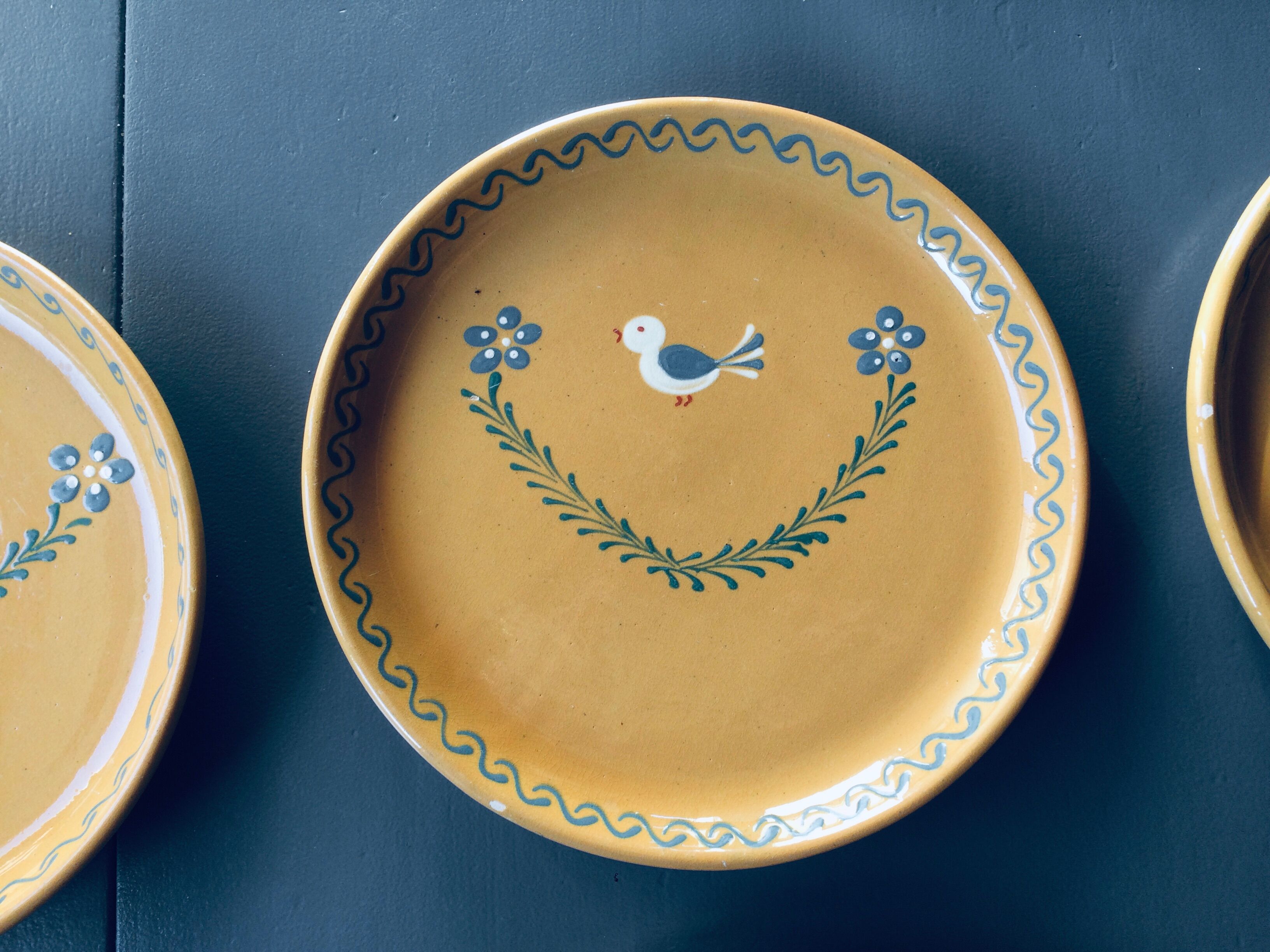 The six Piaf plates in painted terracotta