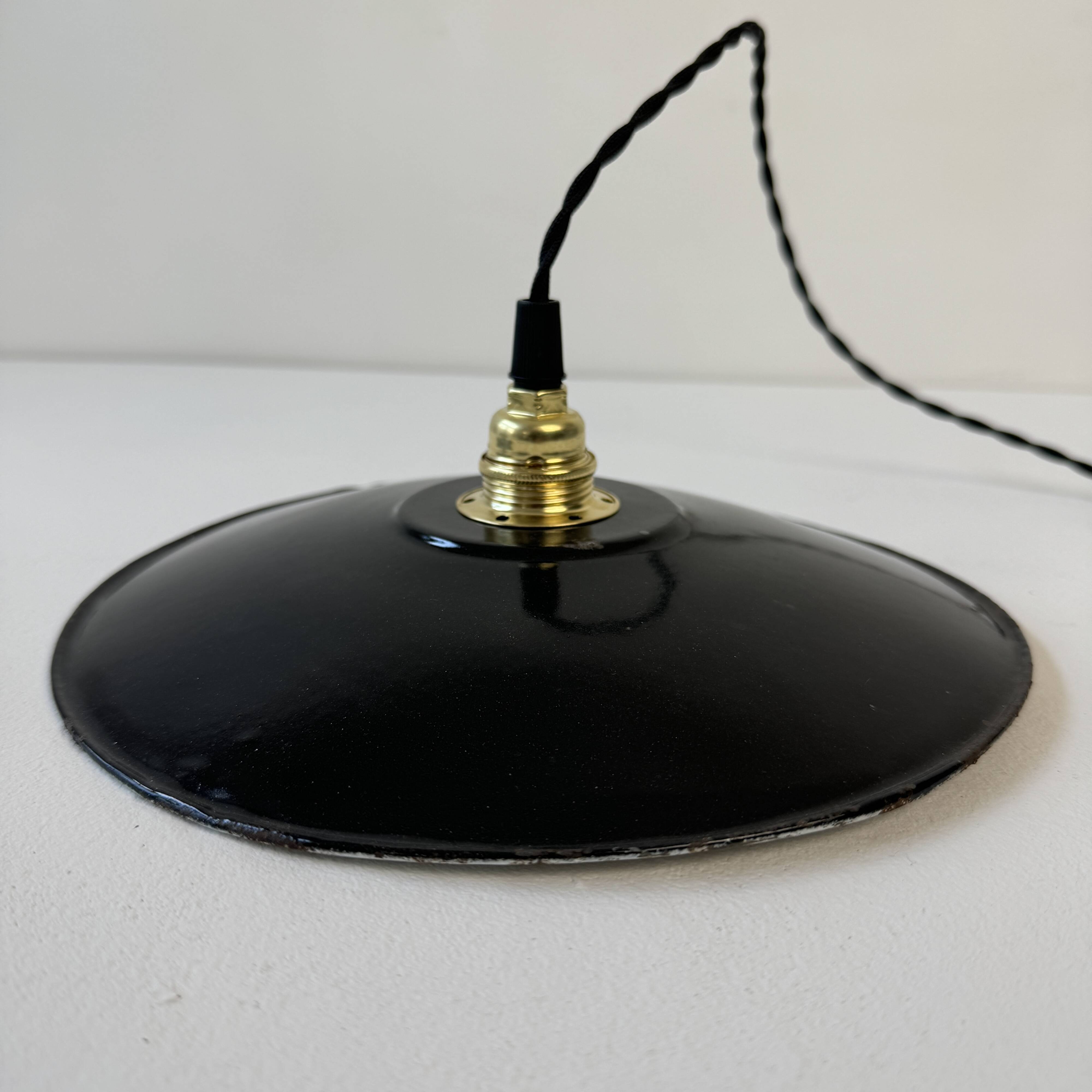 Pair of old industrial black enamelled pendant lights