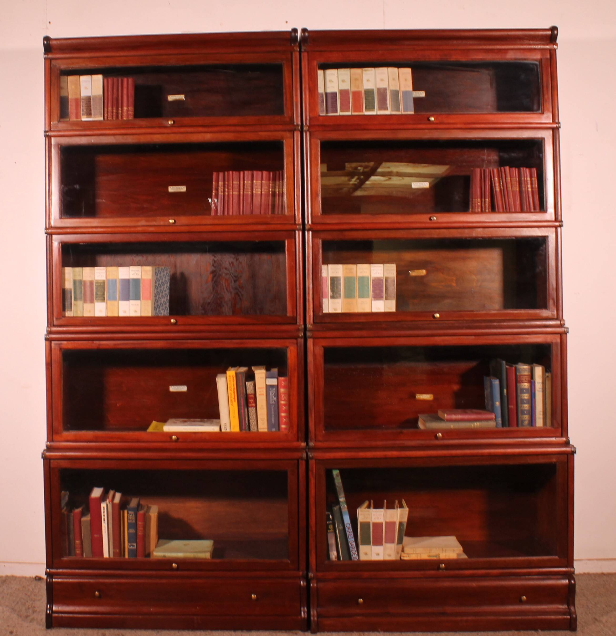 pair of Globe Wernicke London bookcases known as waterfall in mahogany circa