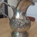 Pewter pitcher decorated with bunch of grapes