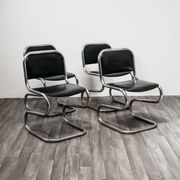 Ensemble de 4 chaises à bascule en acier chromé design années 80 vintage moderne.