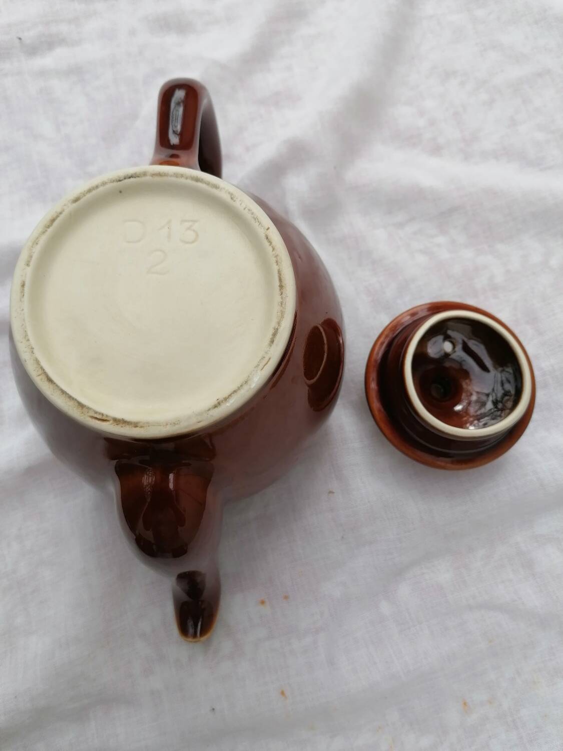 Brown ceramic teapot and milk jugs