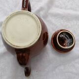 Brown ceramic teapot and milk jugs