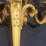 Pair of gilt bronze wall sconces with three lights in the Louis XVI style.