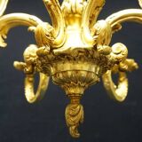 Massive bronze chandelier for candles.