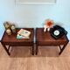 Pair of walnut bedside tables designed by Jacques Hauville for Roche Bobois.