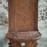 Pair of hand-carved wooden folding chairs – African origin, animal and face motifs, mid-20th century