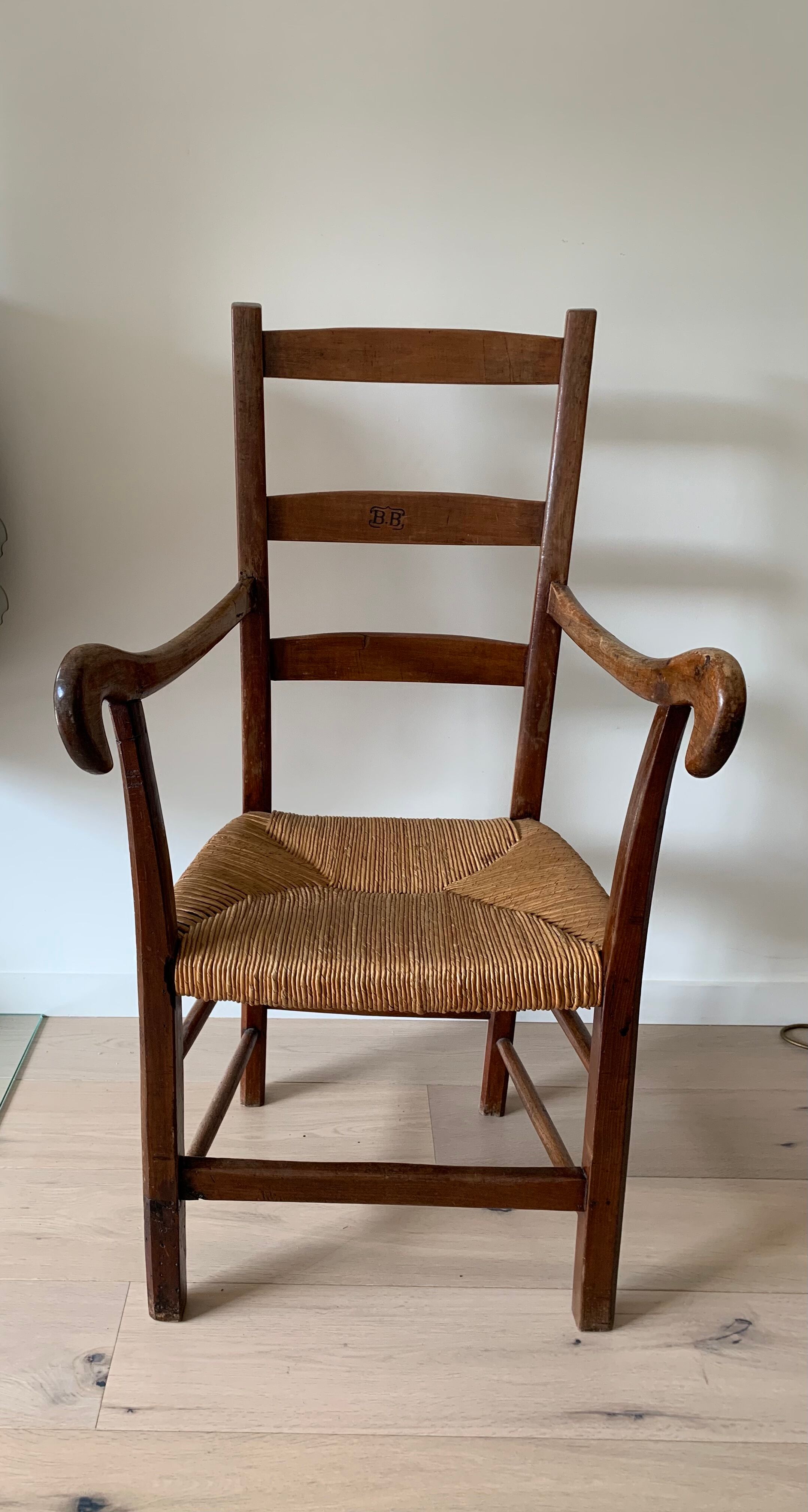 Antique wood and straw armchair