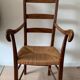 Antique wood and straw armchair