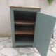 Vintage jam jar enhanced in smoky green, wooden tray.