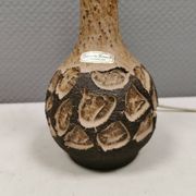 Small beautiful ceramic table lamp in earth colors.