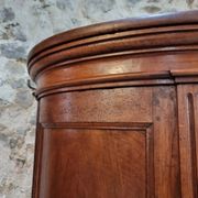 Antique demi-lune cabinet in walnut, late 18th century, French château.