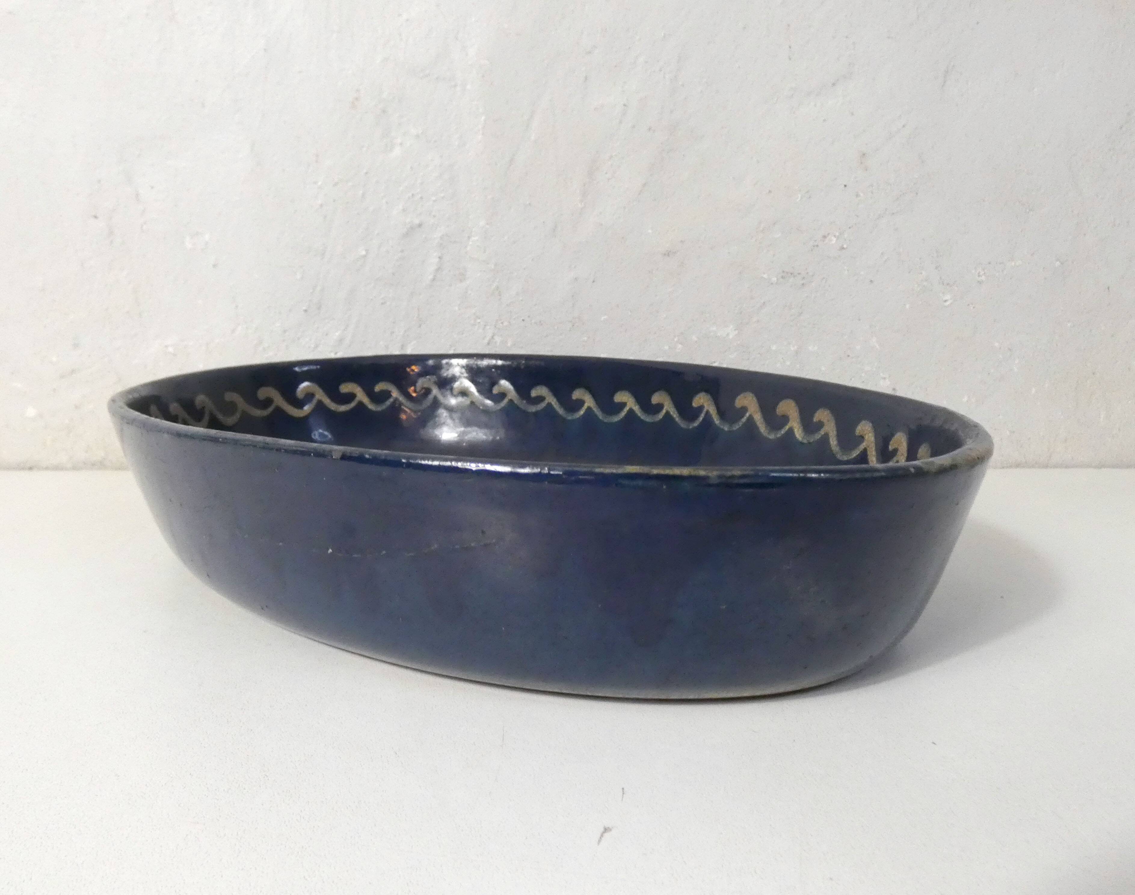 old glazed terracotta dish