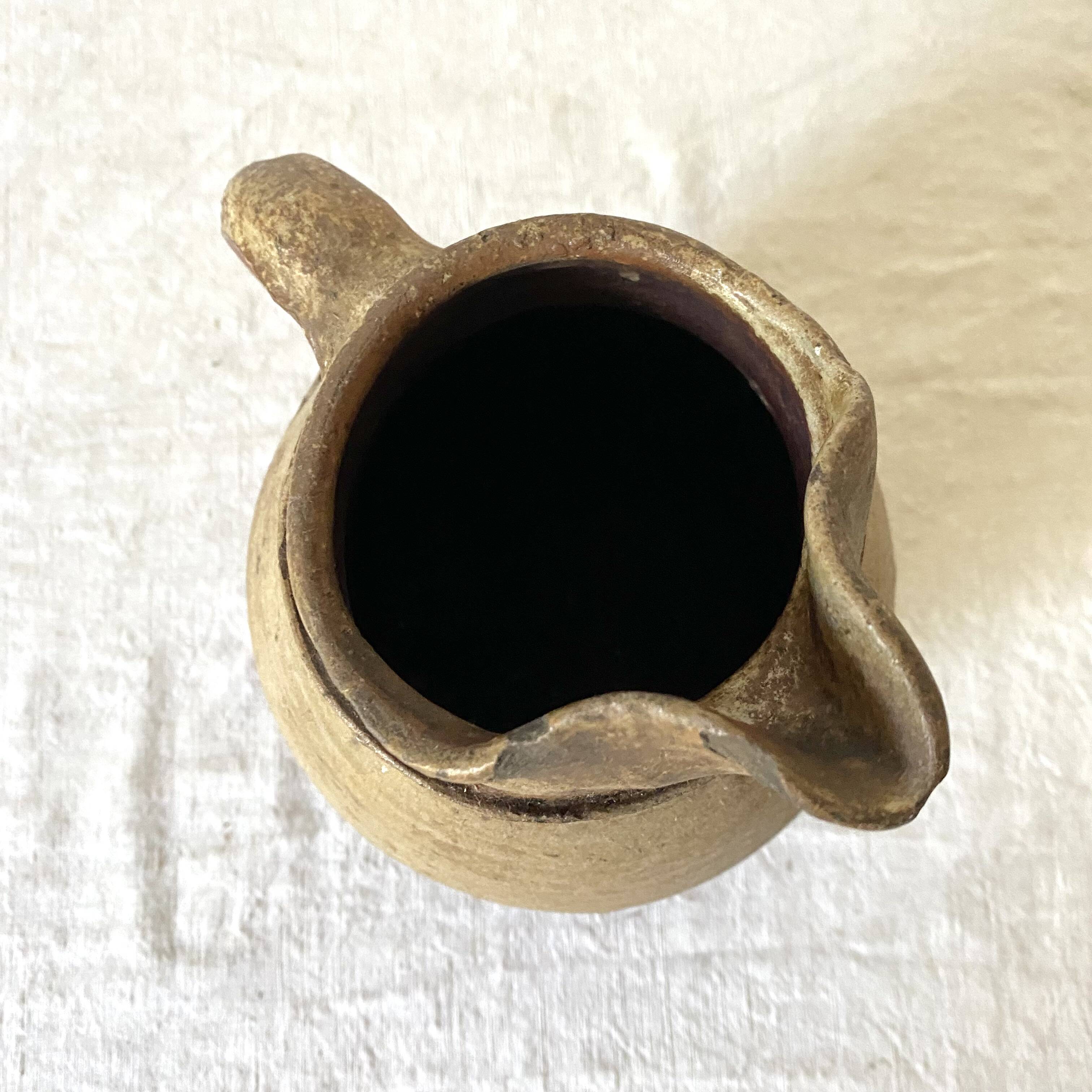 Antique terracotta pitcher