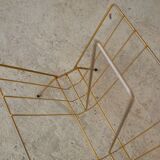 Magazine rack in gilded metal, early 1970s