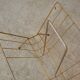 Magazine rack in gilded metal, early 1970s