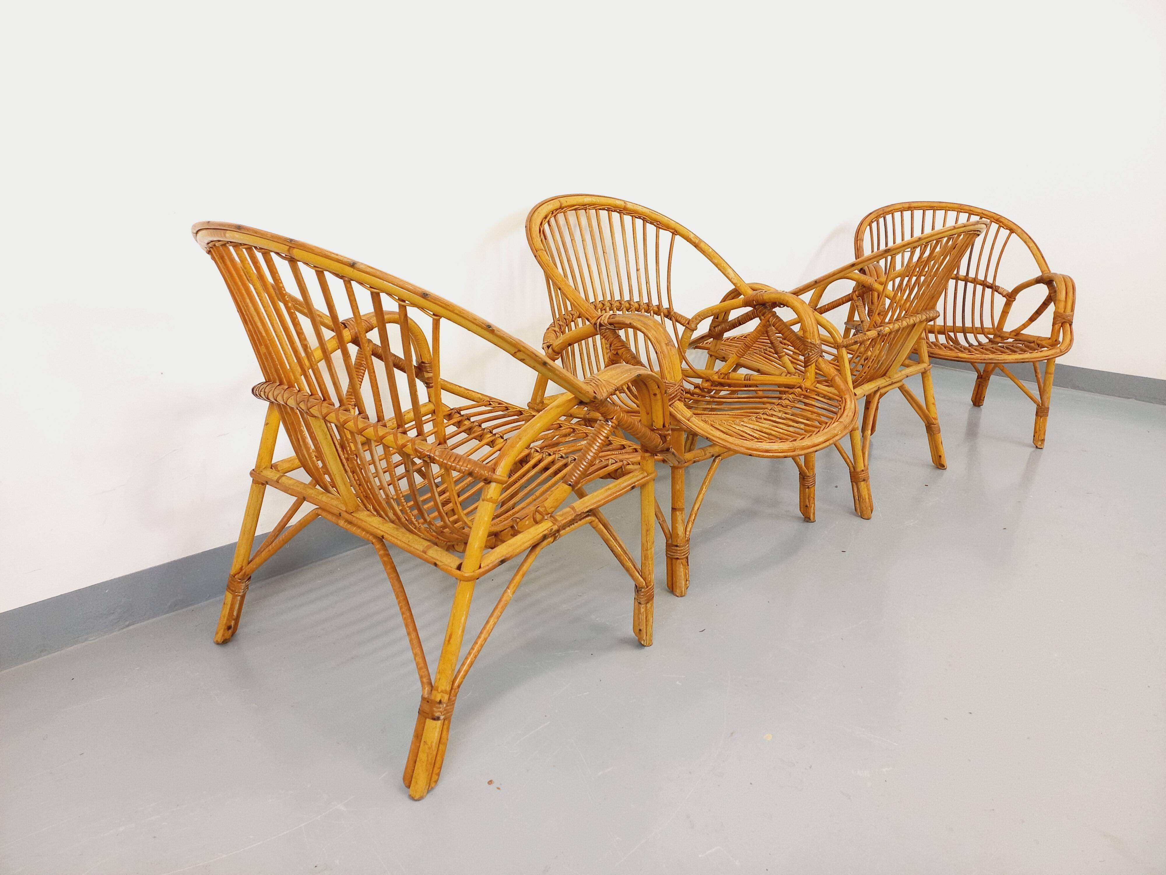 Set of 4 vintage rattan armchairs from the 60s