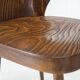 Pair of curved wooden shell armchairs in the style of Oswald Haerdtl.